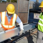 metal roofing workers rollforming